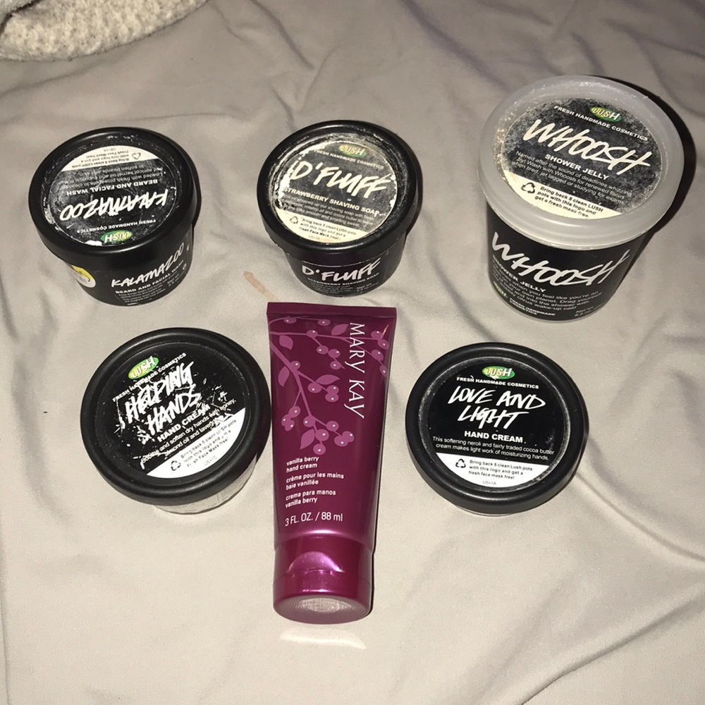 5 empty lush pots and Mary Kay hand lotion